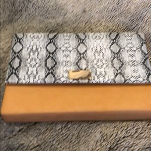 Beautiful clutch never used. Gold chain